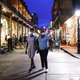 People wearing face masks walk on Bourbon Street in the French Quarter on August 12, 2021 in New Orleans, Louisiana.